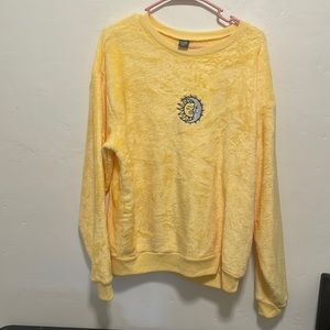Yellow Gold Rush sweater with Sun/Moon embroidery on the front